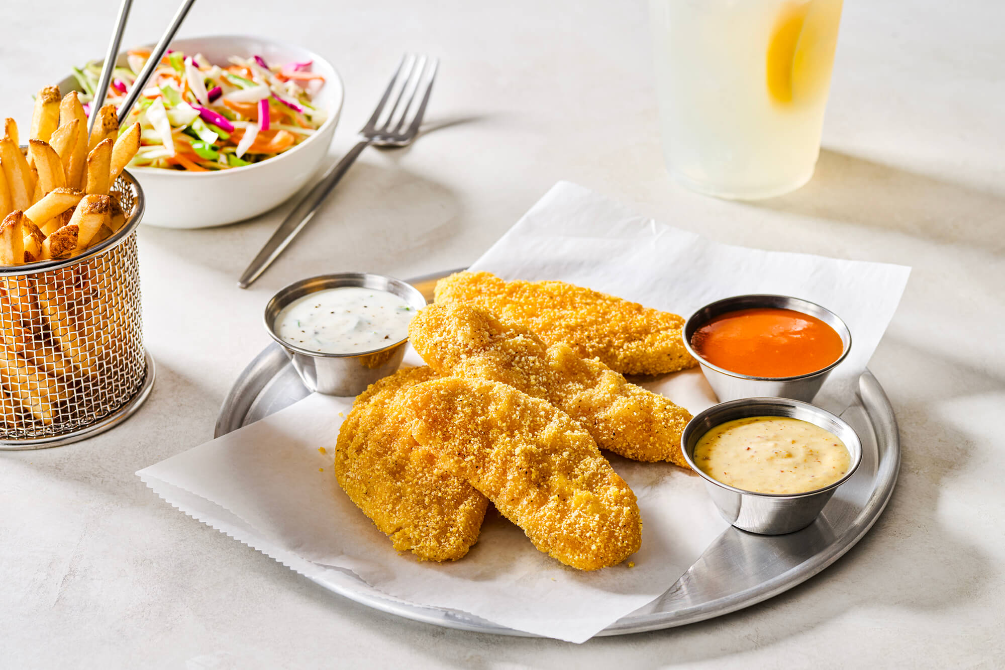 Gluten-Free Chicken Tenders, Served With a Curated Trio of Dipping Sauces and Spicy Housemade Pikliz